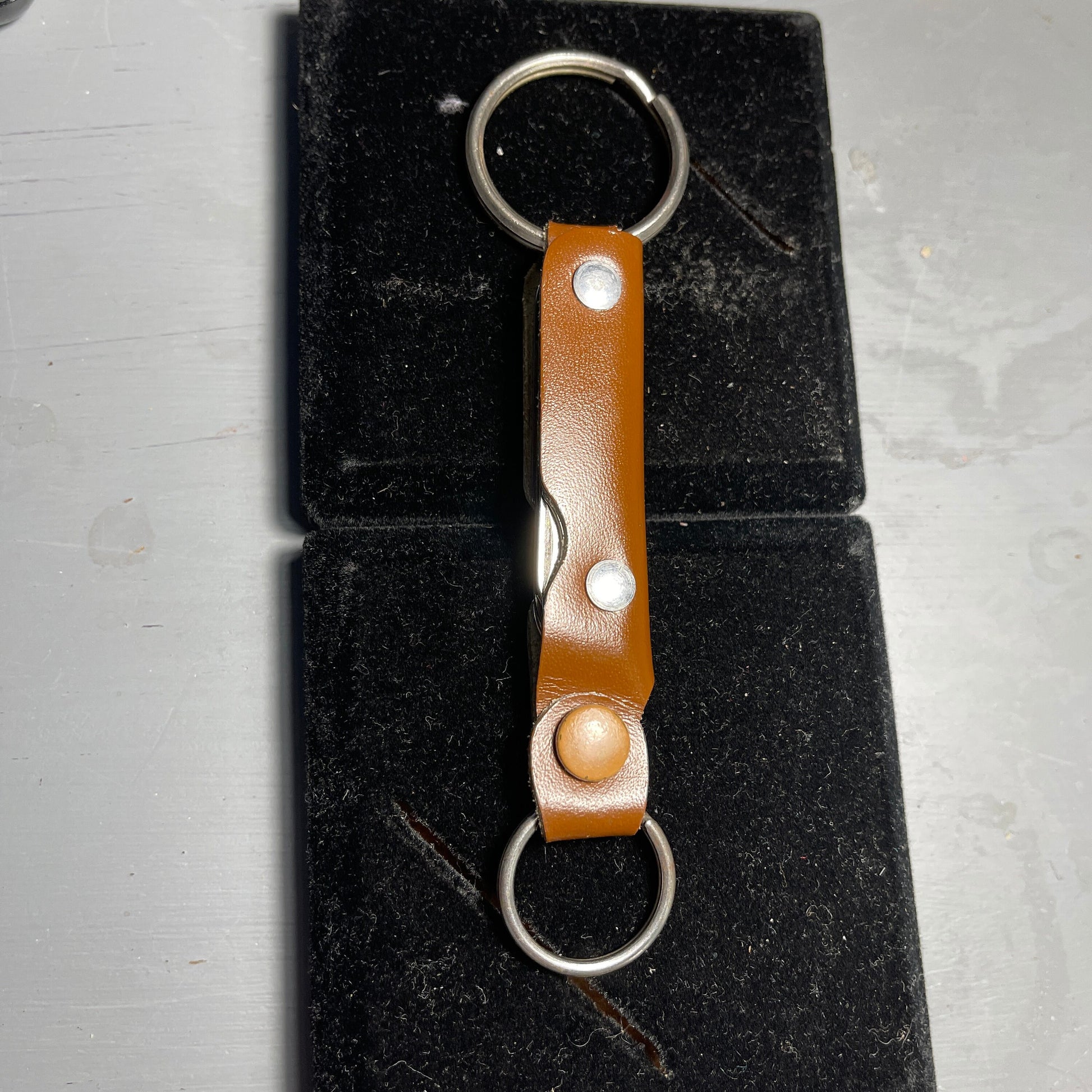 Leatherette Double Keyring with Folding Pocket Knife, Nail File, Bottle Opener, and Screwdriver inside, Vintage Collectible Tool