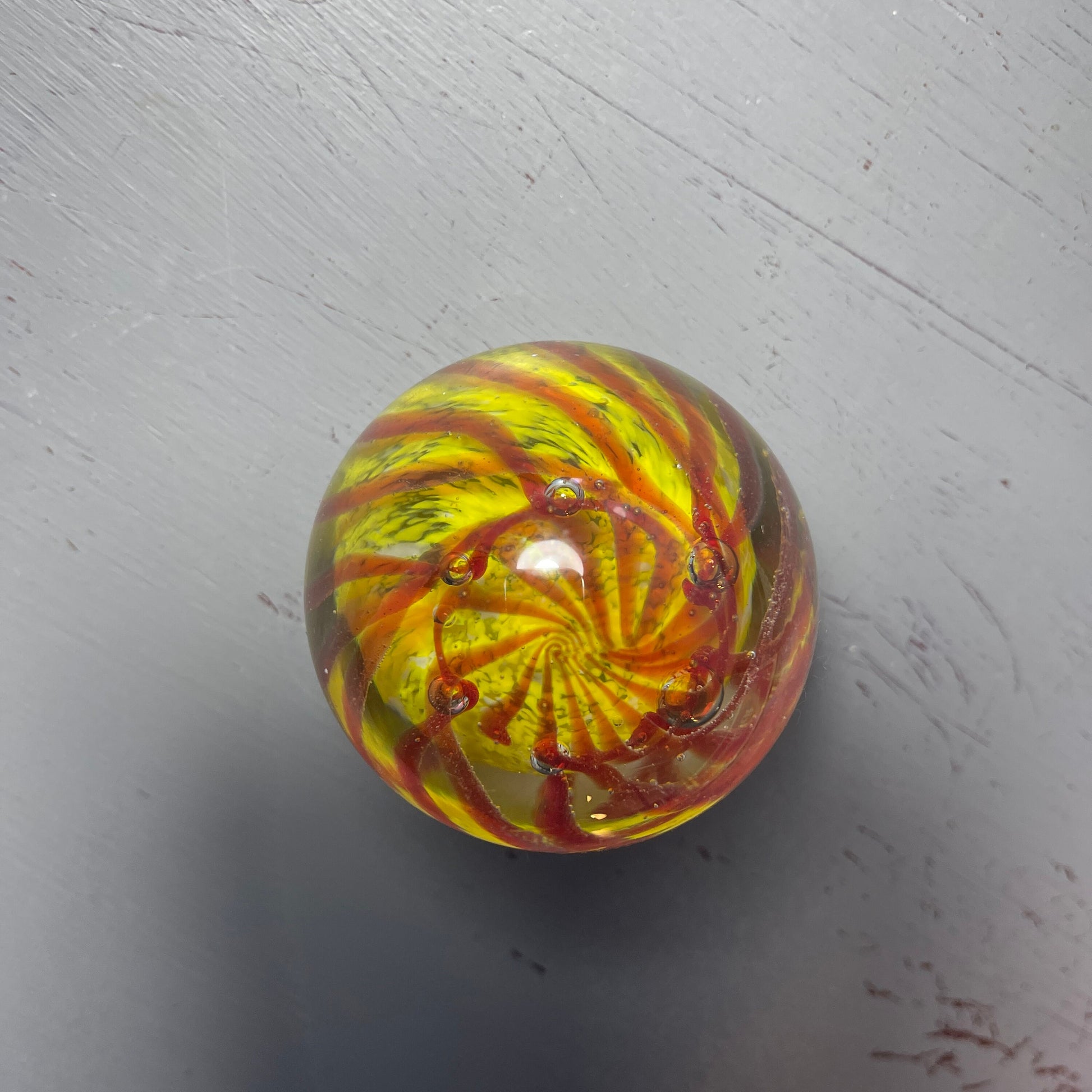 Phenomenal Paper Weight Amber Wavy Lines Set Against Yellow Ball Vintage Collectible Eclectic Decor