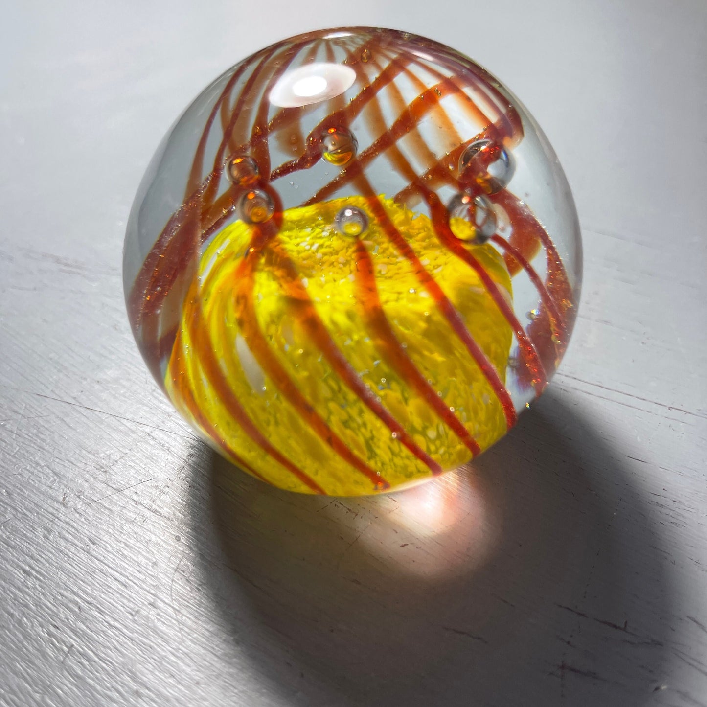 Phenomenal Paper Weight Amber Wavy Lines Set Against Yellow Ball Vintage Collectible Eclectic Decor