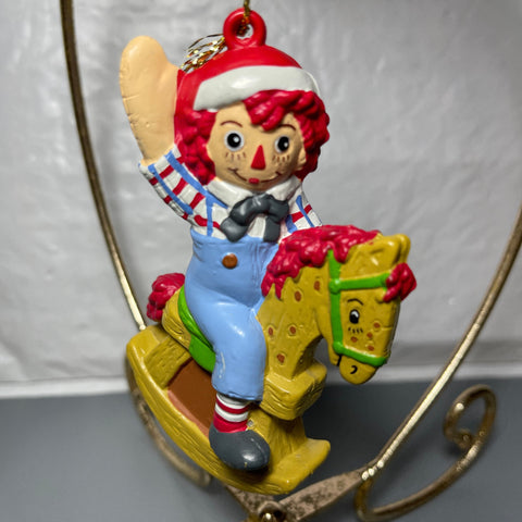 Raggedy Andy In Santa Cap Riding A Rocking Horse Christmas Tree Ornament