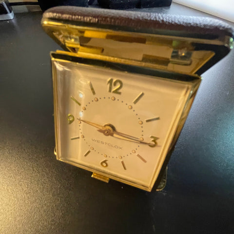 Westclox mechanical wind up travel alarm clock in gold-tone numbers and trim in dark brown case vintage collectible keepsake