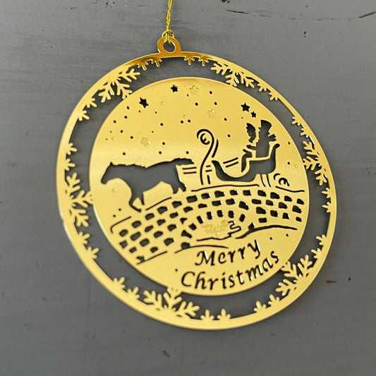 Horse drawn sleigh on an old stone bridge Merry Christmas 2 inch round gold-tone metal ornament