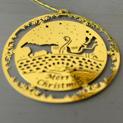 Horse drawn sleigh on an old stone bridge Merry Christmas 2 inch round gold-tone metal ornament
