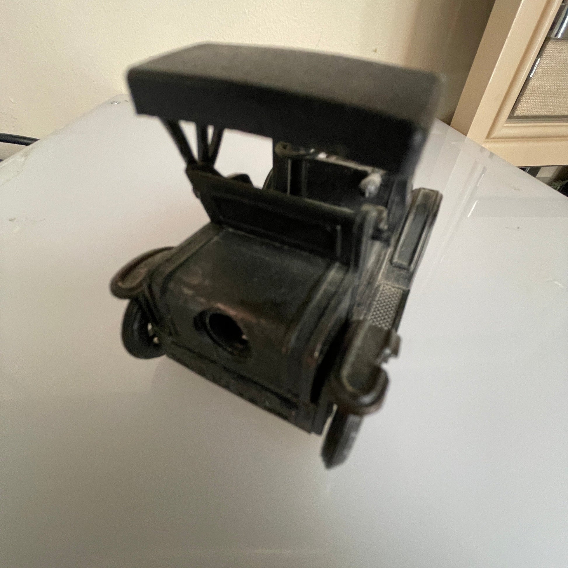 Antique motor car style vintage die-cast metal pencil sharpener