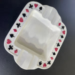 Playing card suits are raised and surround this unique vintage trinket dish/ashtray