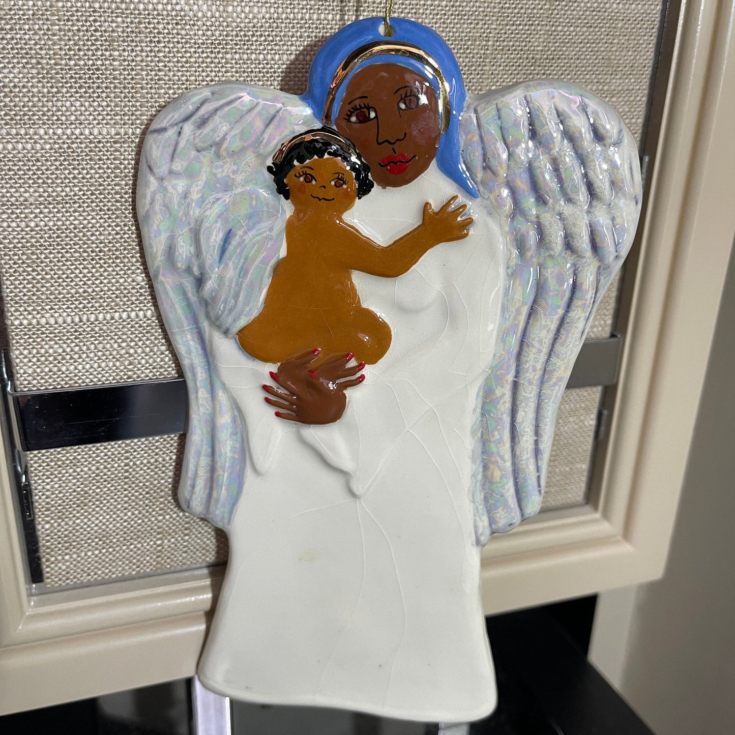 Angel holding Angel child 7 inch tall painted and glazed ceramic vintage ornament