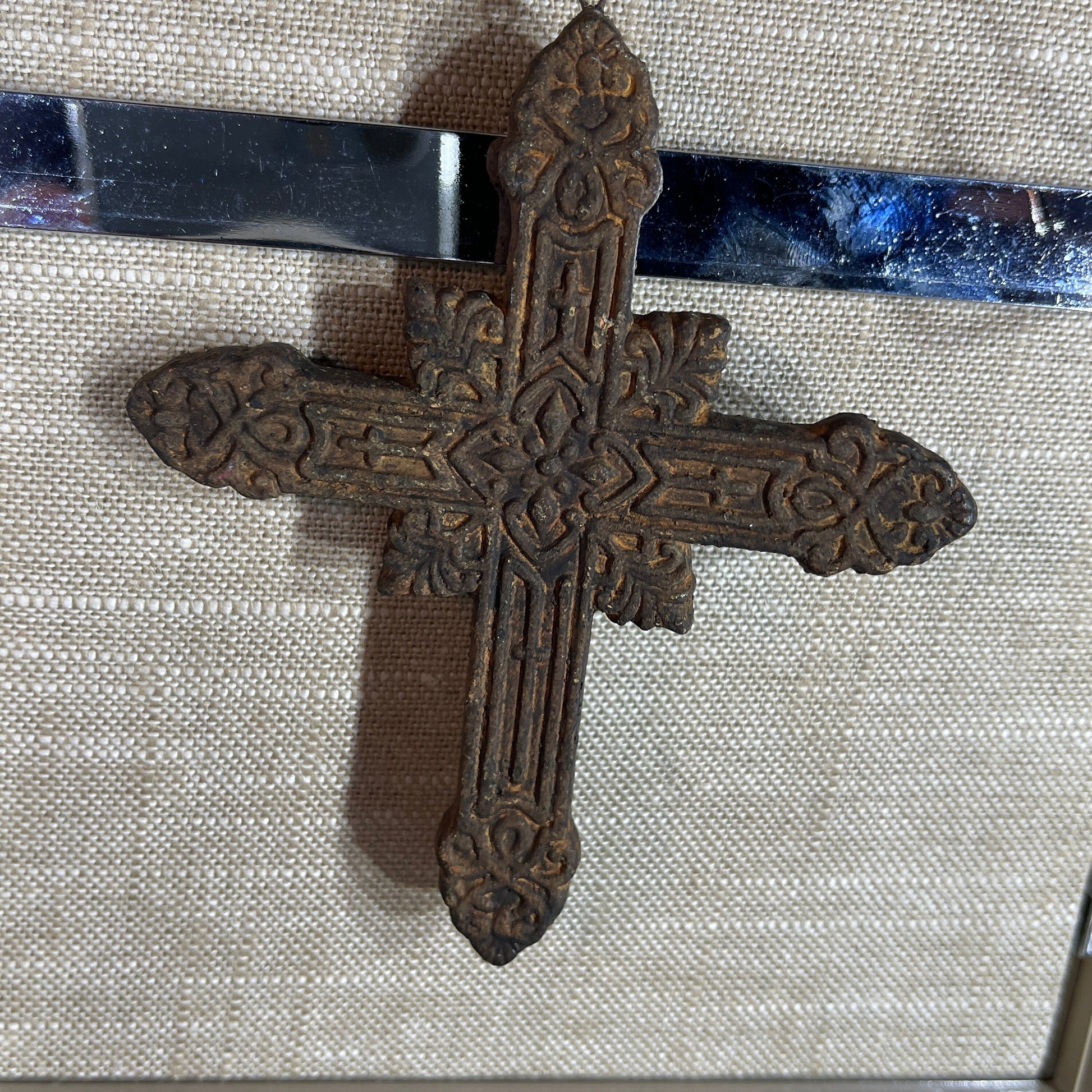 Intricately detailed carved wooden Holy Cross ornament