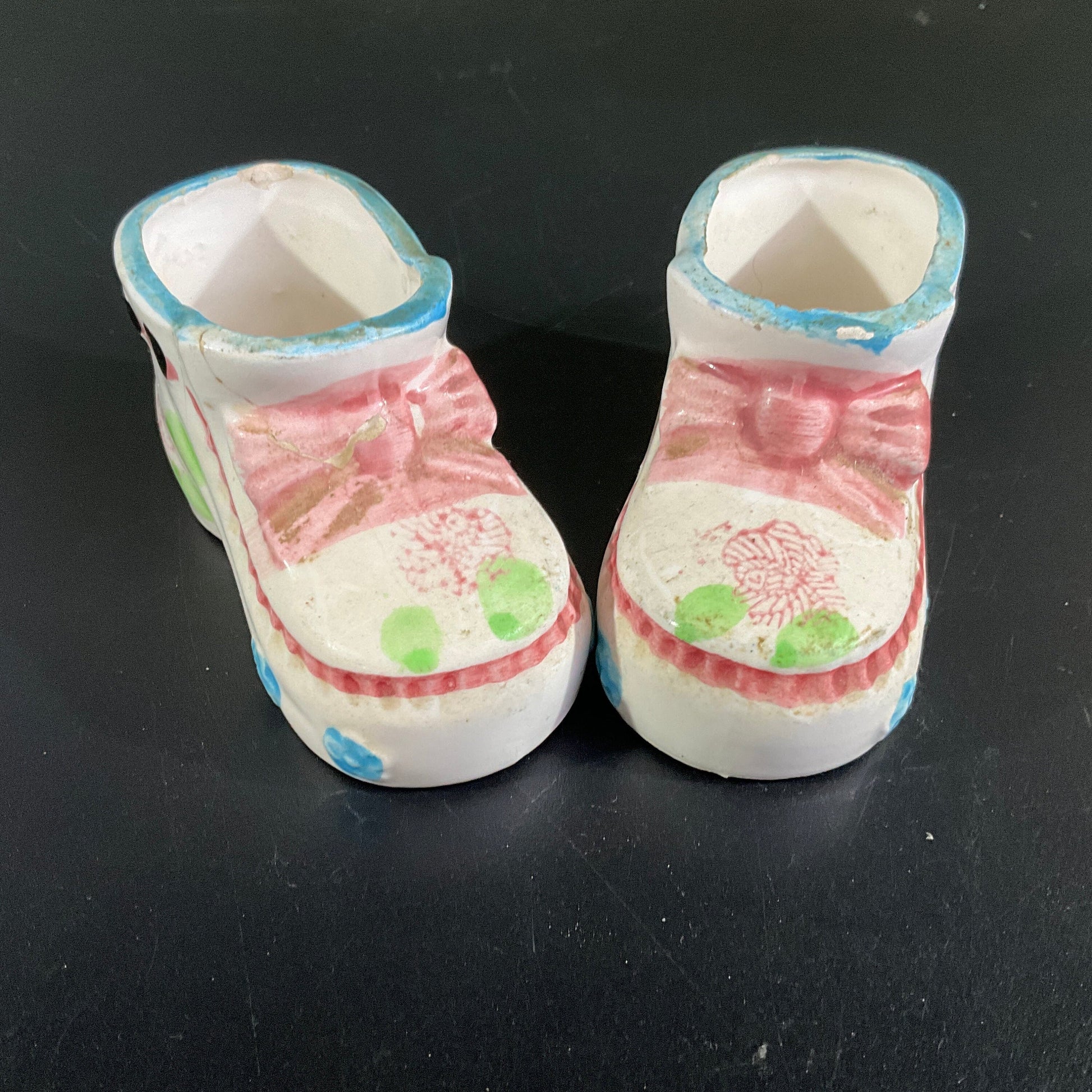 Precious porcelain pair of  baby booties  witj pink bows and blue trim vintage collectible figurines
