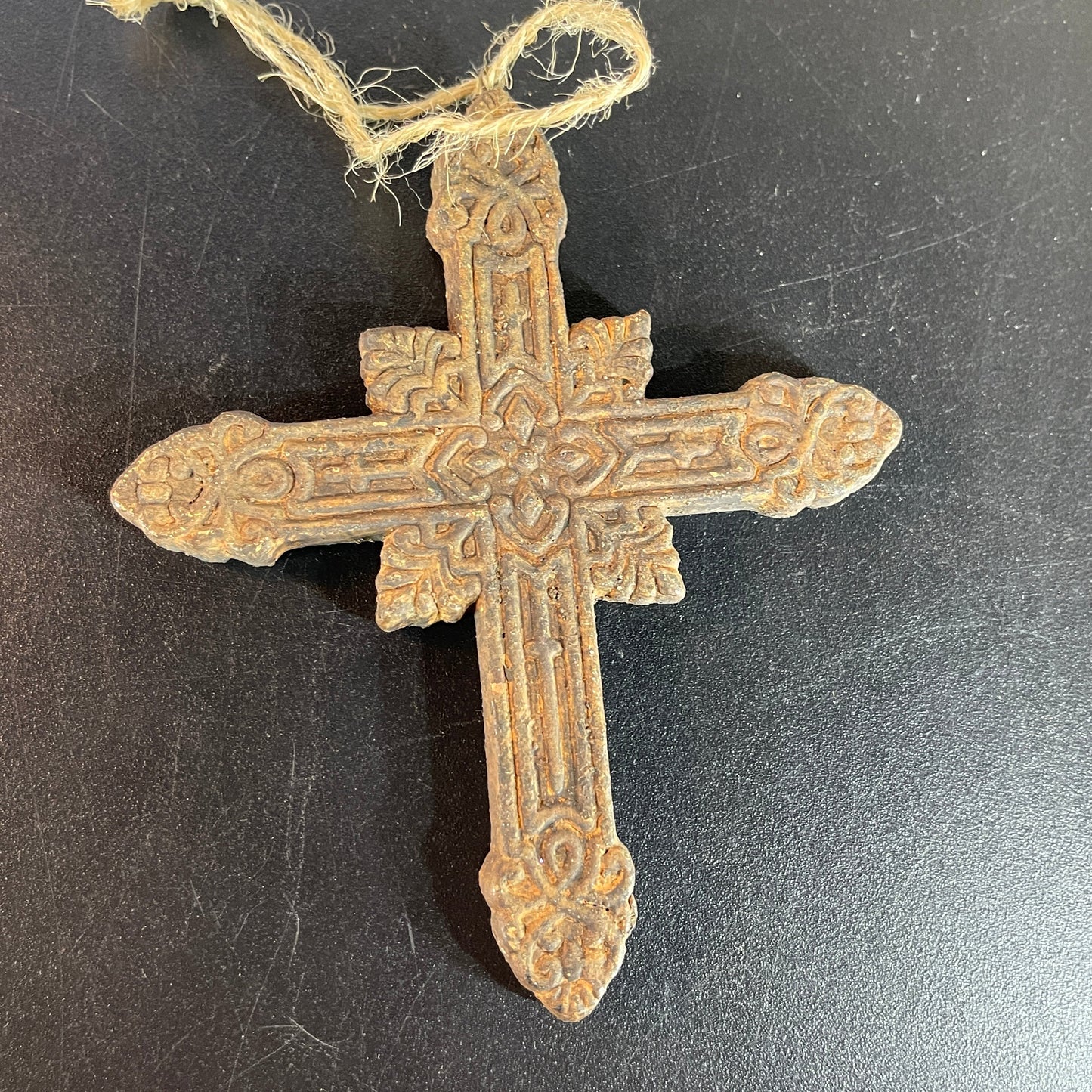 Intricately detailed carved wooden Holy Cross ornament