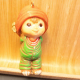 Little Boy in Knit Cap, Hiding Gift Behind His Back, Ornament